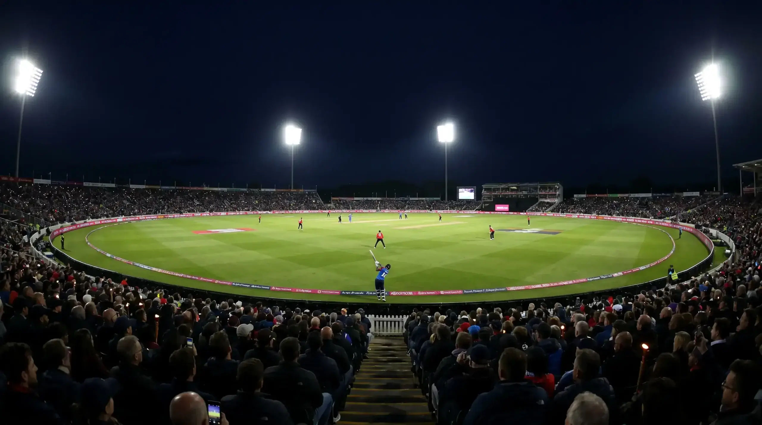 Cricket match under floodlights during evening chase showing conditions affecting batting second