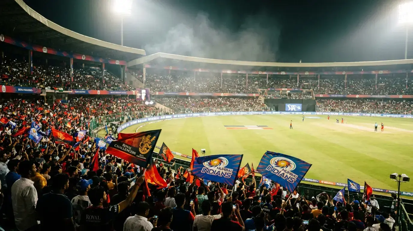 IPL cricket stadium night match under floodlights with packed crowd and colourful franchise banners