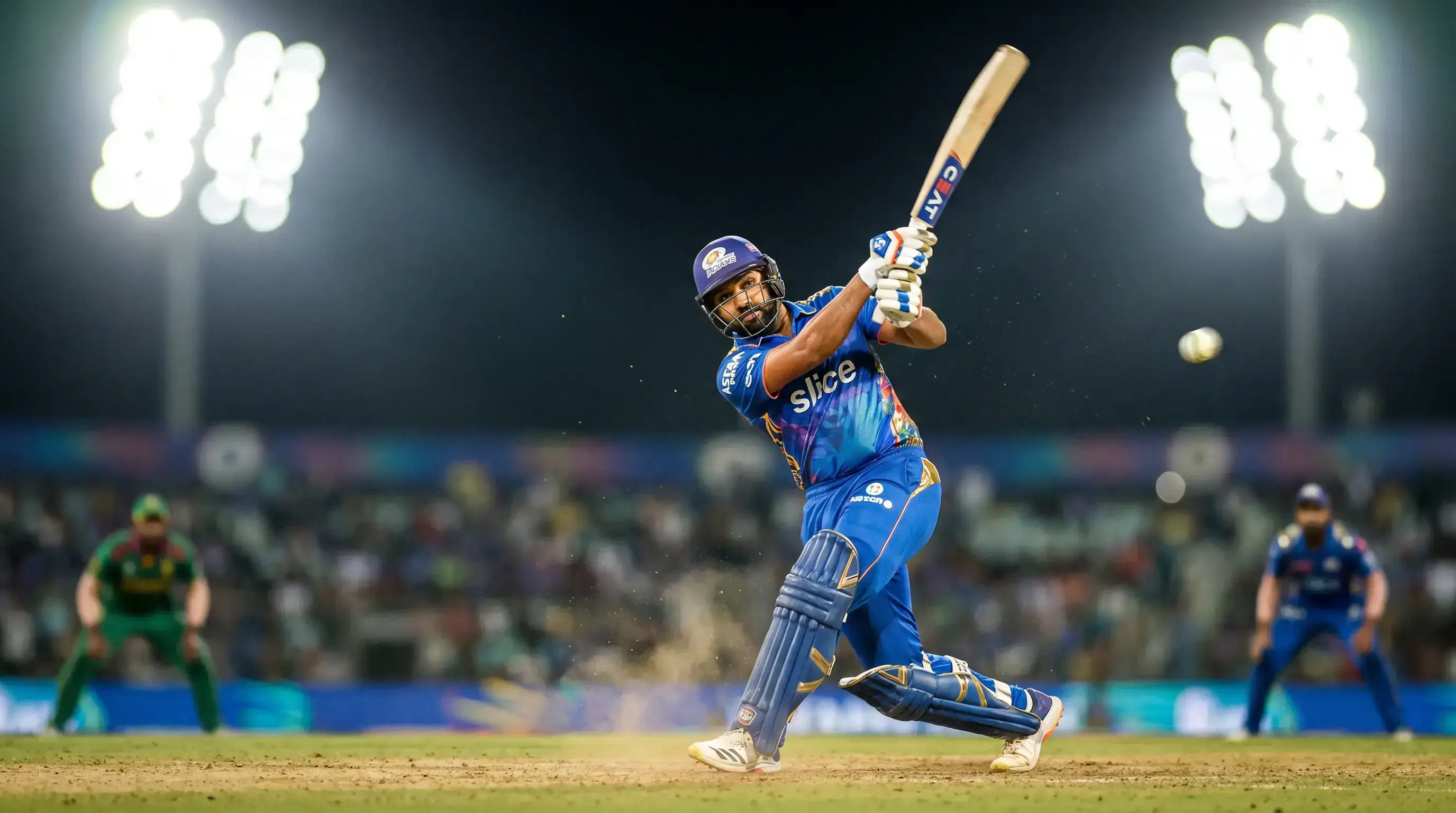 T20 cricket batsman playing an aggressive shot with floodlights illuminating the stadium